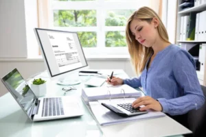 depositphotos_219603344-stock-photo-young-businesswoman-calculating-bill-computer depositphotos_219603344-stock-photo-young-businesswoman-calculating-bill-computer